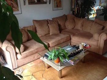 brown sofa in sitting room